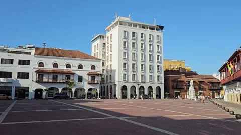 Empty Brick Plaza Framed by White and Red-Balconied Buildings, Colombia 8K Video stock 331499786