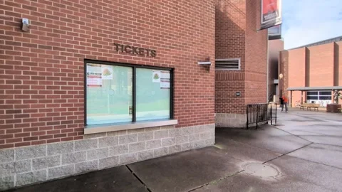 An empty brick ticket booth outside Oregon State University's stadium Stock Footage 341451976