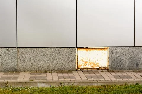 Empty brick wall and green grass ground Stock Photos