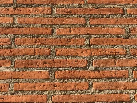 Empty brick wall in day light Stock Photos