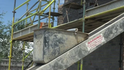 Empty Bricklaying Mortar Bucket Gets Sent Down Elevator Conveyor Belt Stockbeeldmateriaal 166418948