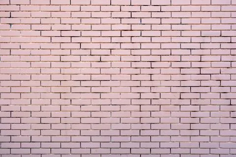 Empty brickwall background texture. Brickwork with row of pink color brick. B Stock Photos