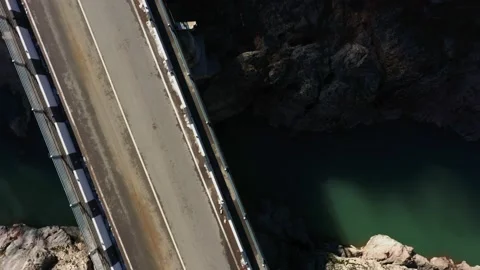 Empty bridge and road top view, rocky coast Stock Footage 183574663