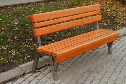 Empty brown bench. Stock Photos