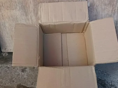 Empty Brown Cardboard Box Open Top View on Concrete Floor Stock Photos