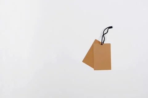Empty brown cardboard tag with string Stock Photos