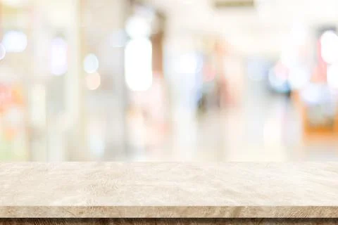 Empty brown cement table over blur store background, product display montage Stock Photos
