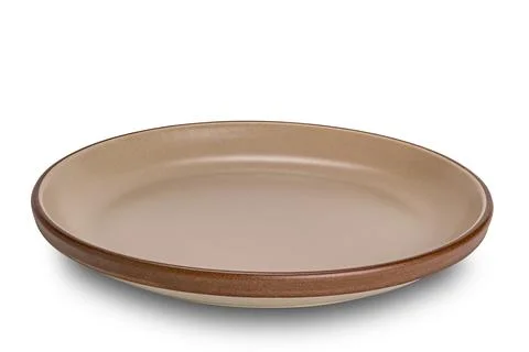Empty brown ceramic dish with dark brown edge. Foto stock