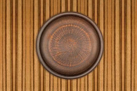 Empty brown ceramic plate on rustic wooden background Stock Photos
