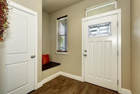 Empty brown entryway interior with white doors and small Bench with  with red Stock Photos