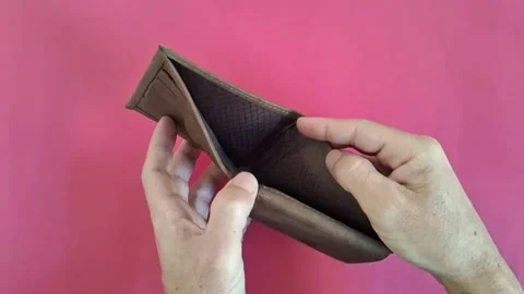Empty brown leather wallet held by hands in motion clip Stock Footage 341438920