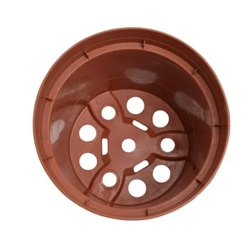 Empty brown plastic flower pot with drainage hole at bottom. Gardening cont.. Stock Photos
