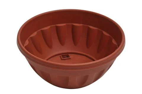 Empty brown plastic flower pot for indoor gardening. Rounded garden planter.. Stock Photos