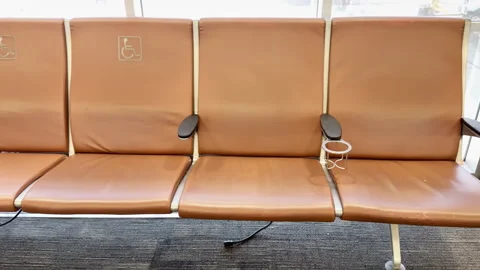 Empty brown seats in quiet airport boarding area Stock-Footage 344905804