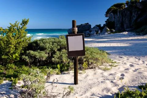 Empty Brown Sign at a Beautiful Beach Stock Photos