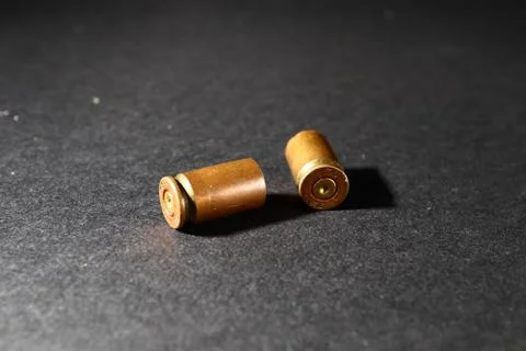 Empty bullet shell casings, on a black background, smoke Stock Photos