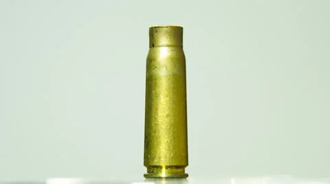 Empty Bullet Shell Rotating on a Blue Screen Background Stock Footage 60061062