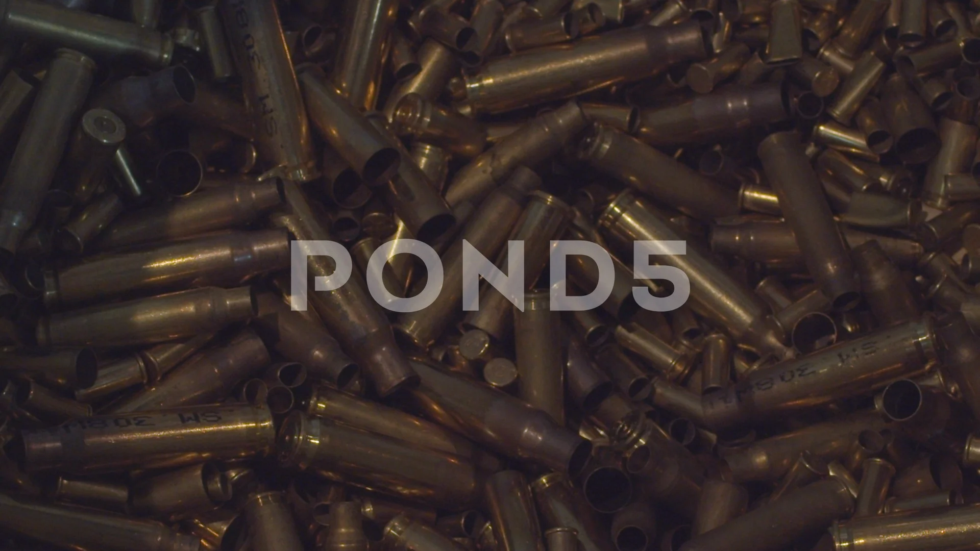 https://images.pond5.com/empty-bullet-shells-being-dumped-footage-118157217_prevstill.jpeg