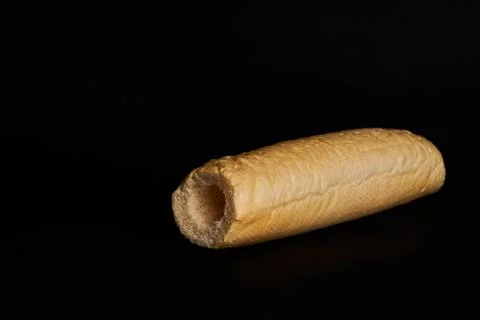 Empty bun isolated on black background 库存照片