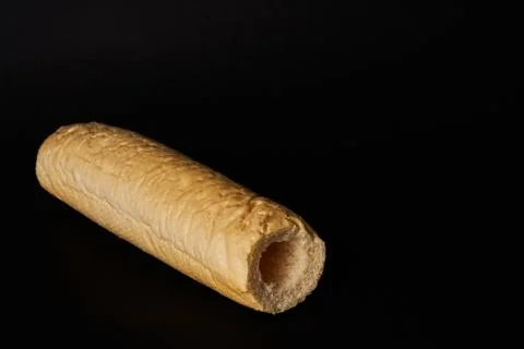 Empty bun isolated on black background Фото