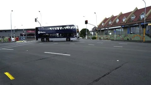 Empty bus drives the empty streets of suburban Auckland. Stock Footage 137980309