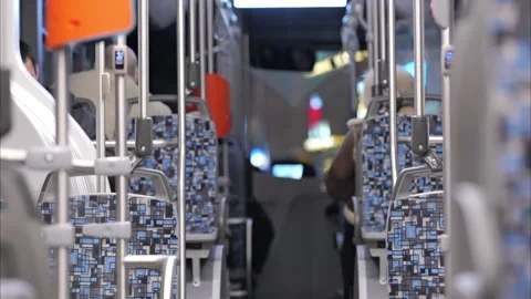 Empty Bus Interior with Blue Patterned Seats Stockbeeldmateriaal 334078663