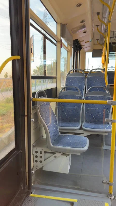 Empty bus runs along the country road. View from inside the bus Stock Footage 282570105