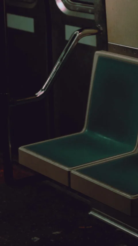 Empty bus seats in a city late at night with soft lighting Stock Footage 336253344