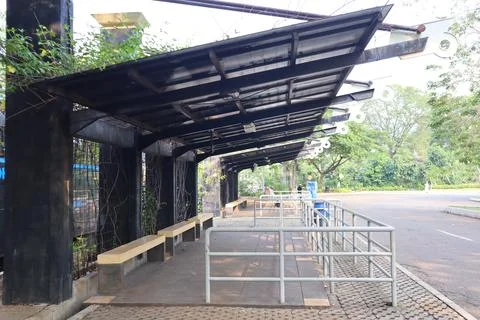 Empty bus stop. midday. no vehicles Stock Photos