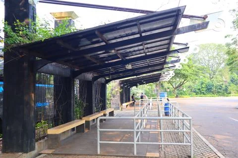 Empty bus stop. midday. no vehicles Stock Photos