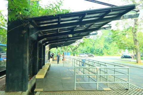 Empty bus stop. midday. no vehicles Stock Photos