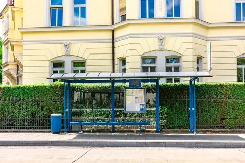 Empty bus stop in Munich on summer sunny day, Bavaria, Munich, Germany Stock Photos