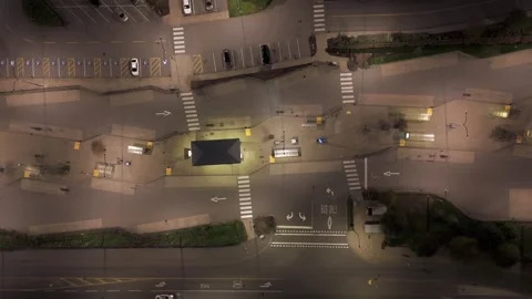 Empty Bus Stop at Night - Aerial Top Down Vertical View Dolly In Stock Footage 328336947