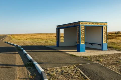 Empty bus stop on the road Stock Photos
