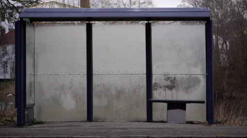 Empty bus stop with transparent panels in overcast weather. Stock Footage 335425193