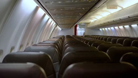 Empty cabin of a passenger plane. Seating and Seating Selective Focus. A seat in Stock Footage 145942516