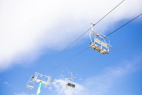 Empty cable car in the mountains ski resort. Ski lift in the mountains Stock Photos