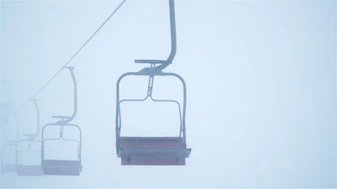 Empty Cable Car at Witnter Mountains with Fog and Snowfall Stock Footage 105735419