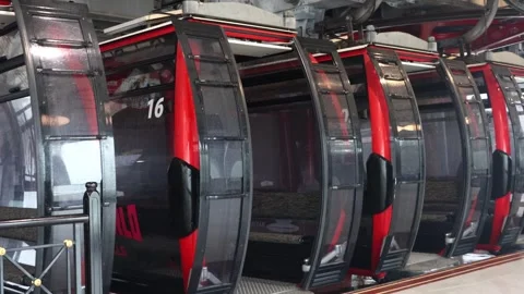 Empty cable cars arrive at the cable car station in Sun World Stock Footage 320516223