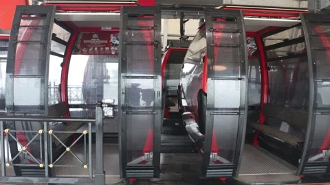 Empty cable cars ride inside the cable car station in Sun World Stock Footage 314061895