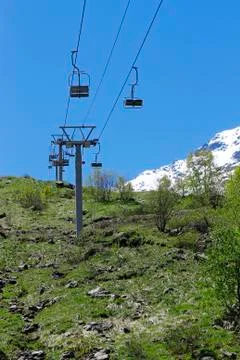 Empty cableway and caucasus mountains background Stock Photos