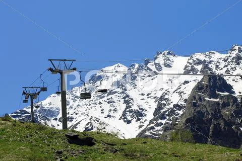 Empty cableway and caucasus mountains background Stock Photos
