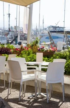 Empty cafe against sea Stock Photos