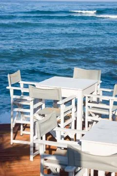 Empty cafe against sea Stock Photos