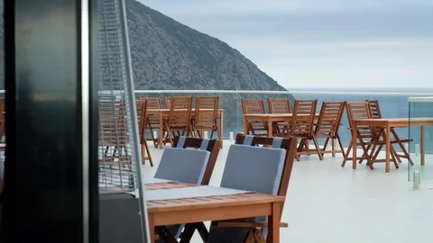 An empty cafe on the background of mountains and sea Stock Footage 83563349