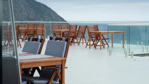 An empty cafe on the background of mountains and sea Stock Footage 83563389