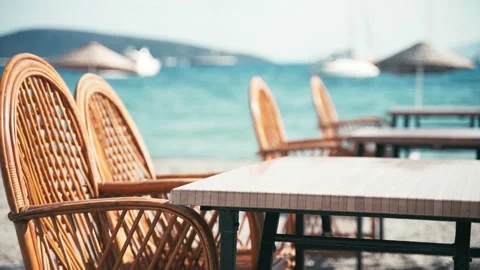 Empty cafe on the beach, empty city spaces. Summer vacation concept. Handheld Stock Footage 132382494