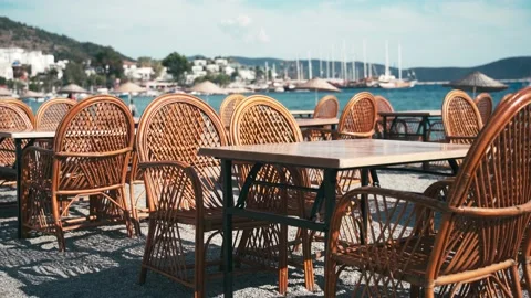 Empty cafe on the beach is waiting for guests. Summer vacation concept Stock Footage 132382565