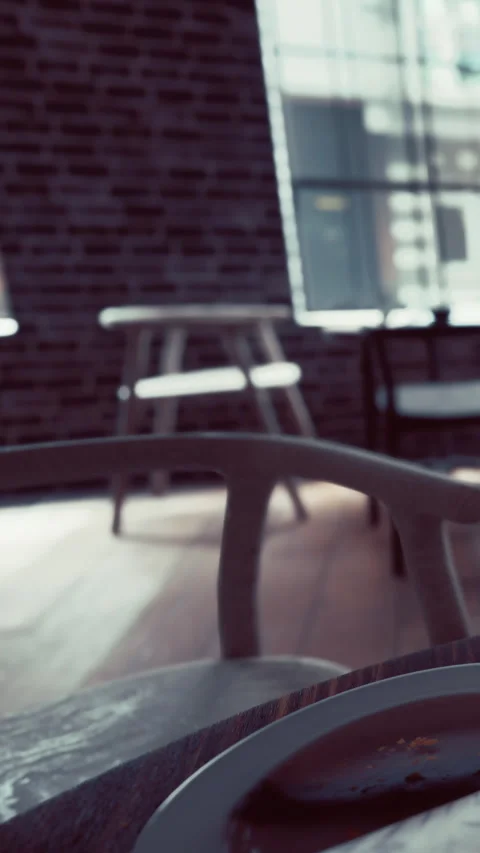 Empty cafe space with simple furniture and large windows during daytime Stock Footage 335098422