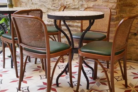Empty cafe table and chairs in a cozy corner Stock Photos